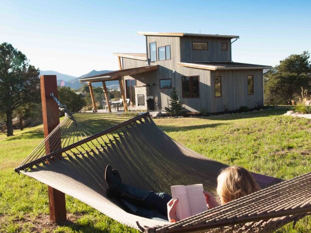 A glamper relaxes at Royal Gorge Cabins • Photo courtesy of Royal Gorge Cabins