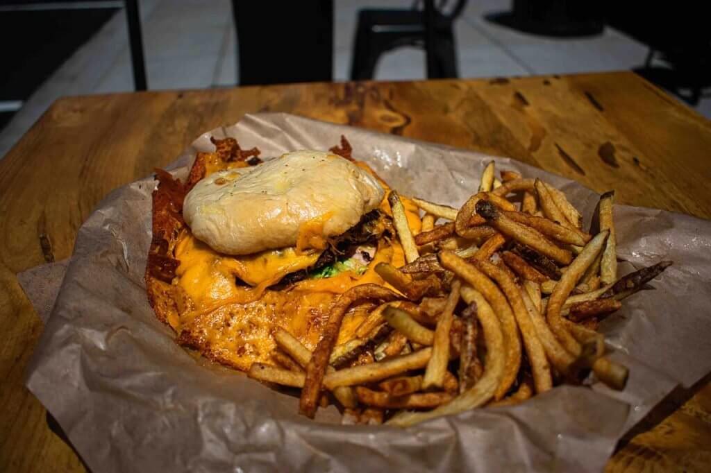 Skirted Heifer's namesake burger is "deliciously gooey" • Photo by Matt Morris, @mmorrisphotography_